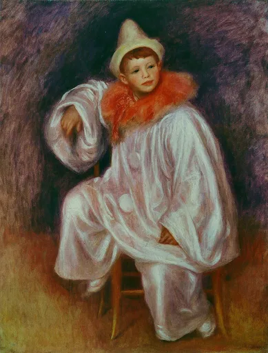 A young boy in a loose white pierrot costume with pointed cap and orange ruff sits on a small chair against a dark purple background