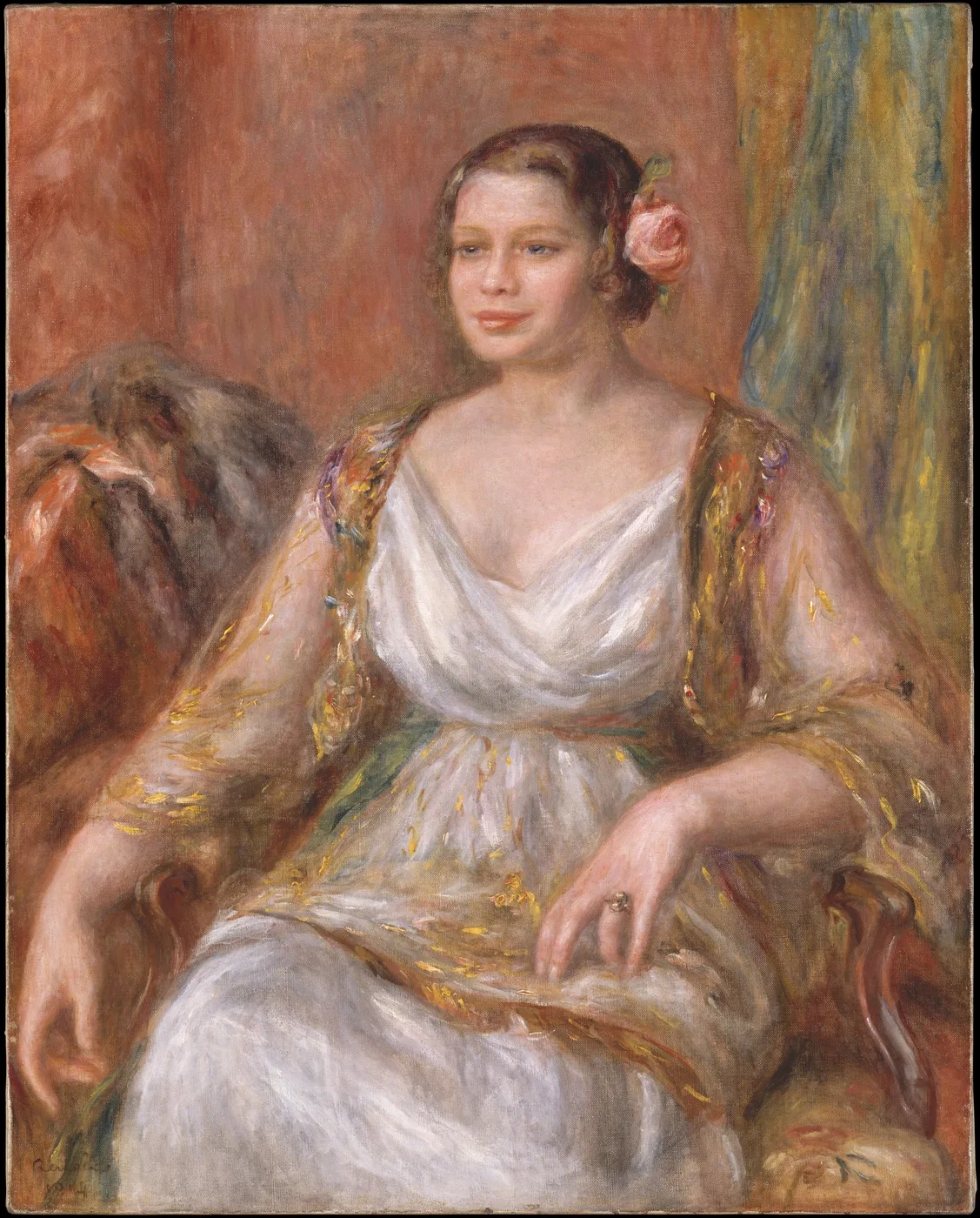 A seated woman with a pink rose in her hair wears a draped white gown with gold trimmed sleeves, resting one arm on a fur throw, against a warm red backdrop