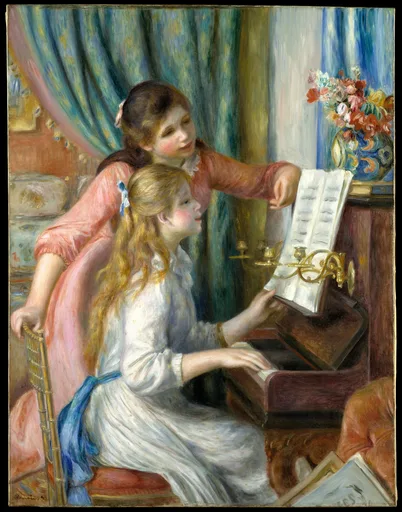 Two young girls at an upright piano, one in white playing and one in pink turning the sheet music, beside a vase of flowers