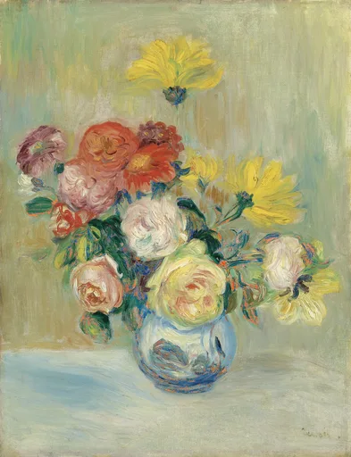 A round blue glass vase overflowing with roses in cream, pink, and red, alongside yellow dahlias, set on a pale tabletop against a soft green background.