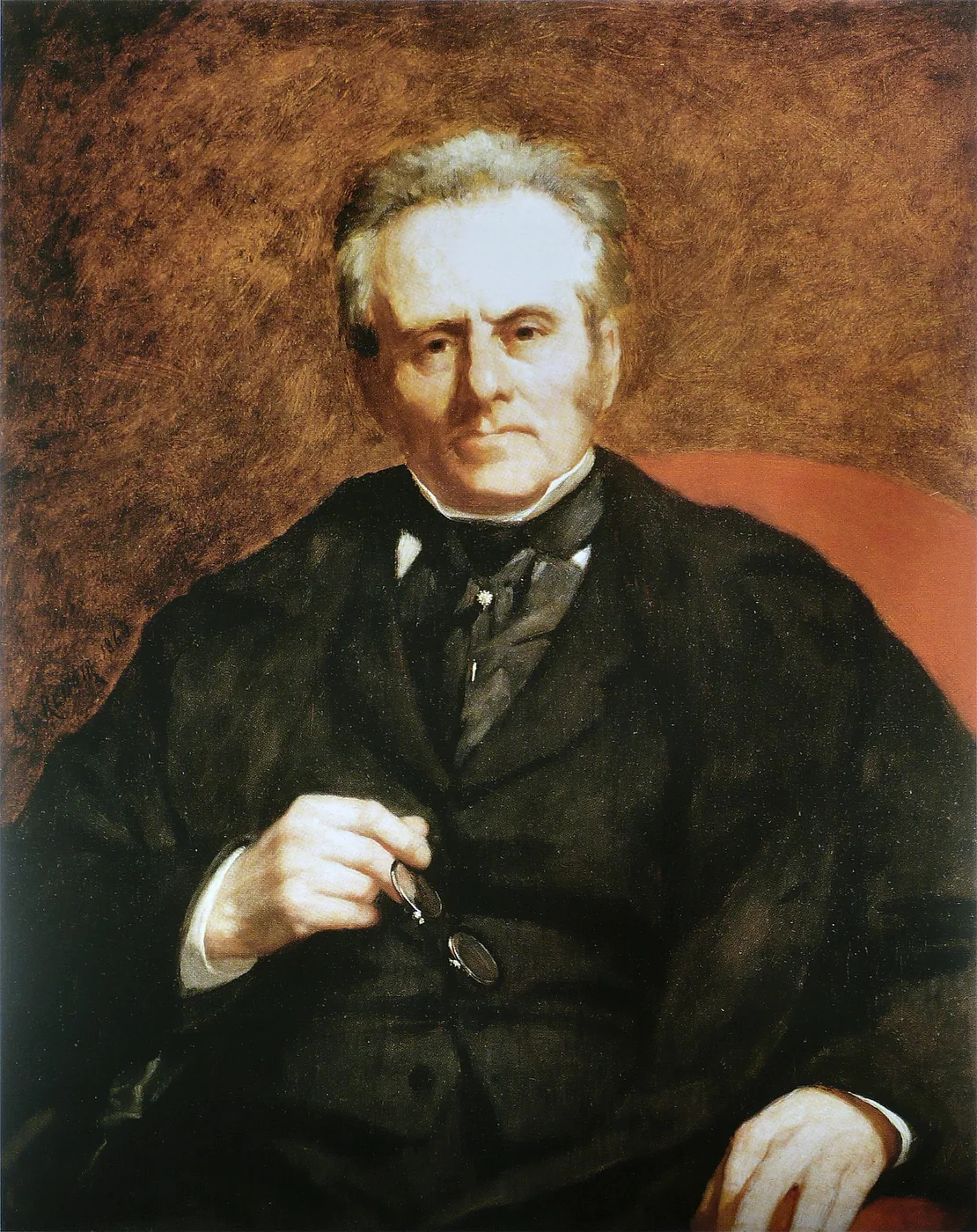 An elderly white-haired man in a black coat holding a pair of spectacles, seated against a red chair back, in dark brown and warm ochre