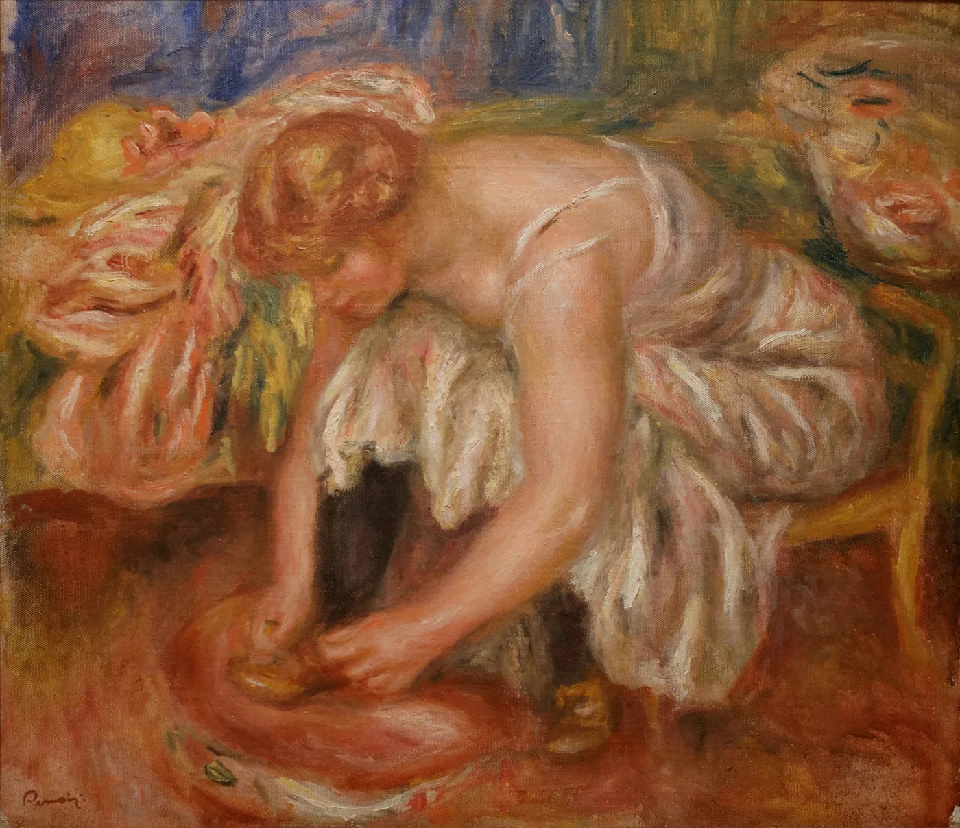 A bare-shouldered redhead woman bends forward tying her shoe, seated on a chaise, in warm pink, cream, and rust orange tones