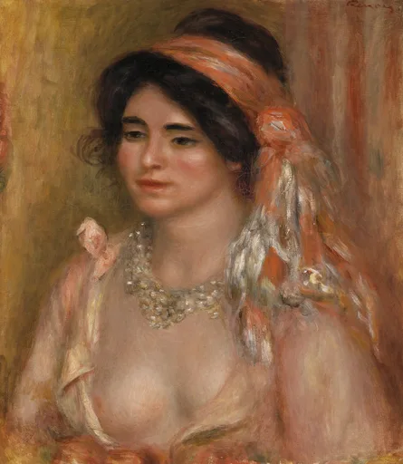 A dark-haired woman in an orange headscarf and beaded necklace, bare-shouldered, against a warm golden background