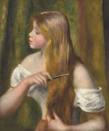 A young girl with long strawberry blonde hair combs it with a small comb, wearing an off-shoulder white blouse, against an olive green backdrop