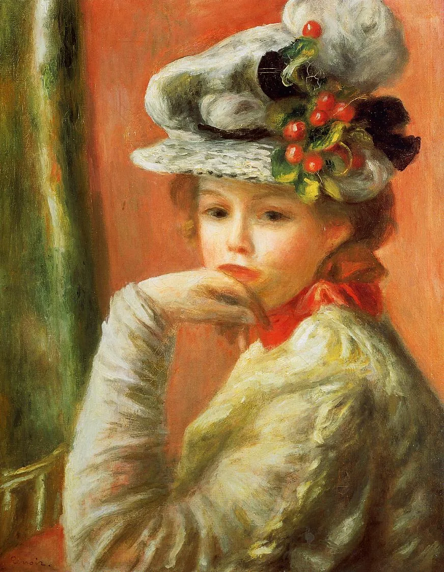 A woman rests her chin on her hand, wearing a white hat trimmed with red berries and a red scarf, against a coral background.