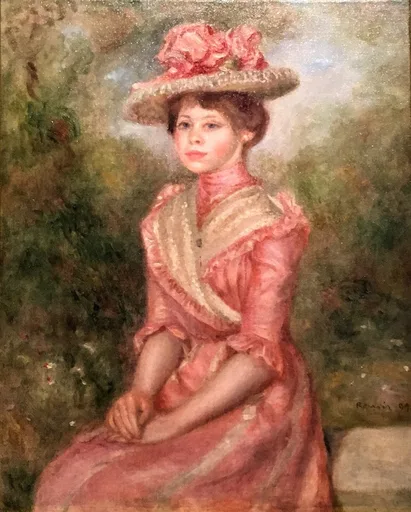 A young woman in a pink dress and rose trimmed hat seated in a garden, in soft pink, cream, and green